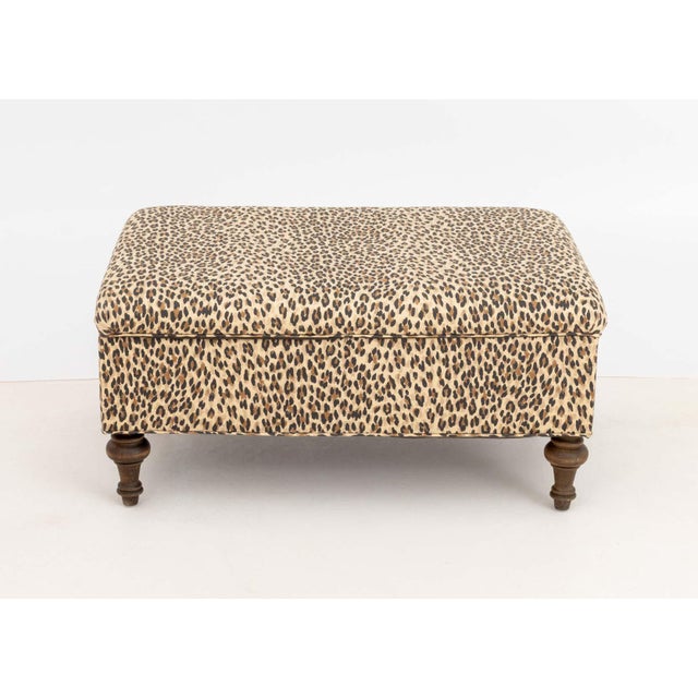 George Smith Style Leopard Print Upholstered Storage Ottoman, with lift top lid on four turned wood legs. 18.5" H x 38" W...