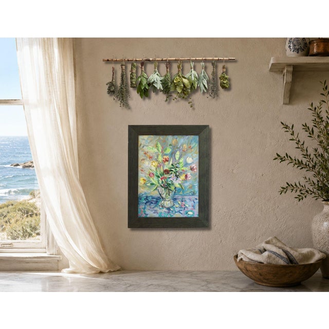 A vibrant mid century French oil on board depicting a colorful bouquet in a glass vase. Signed by the artist, this light...