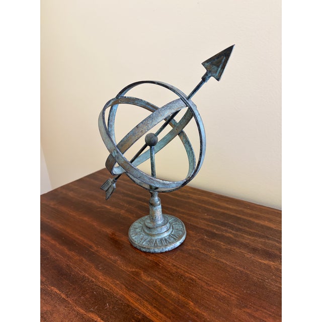 A beautifully crafted iron armillary sphere, evoking the timeless elegance of classical European gardens. Pieces like this...