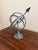 A beautifully crafted iron armillary sphere, evoking the timeless elegance of classical European gardens. Pieces like this...