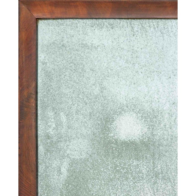 American Flame Mahogany Ogee Mirror. Mirror plate: 25.75" H x 14.5" W; frame: 34.75" H x 23.75" W x 1.75" D. Provenance:...