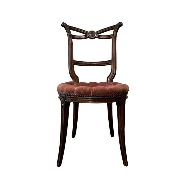 A charming Italian Neoclassical Revival side chair with a carved wood frame and refined classical detailing. The back...