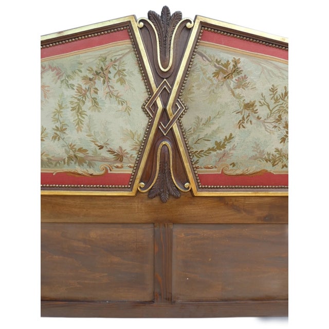 Padded headboard with gold lacquered profiles.