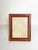 The photo is not provided. An elegant brown leather-covered photo frame, characteristic of refined decorative accessories...