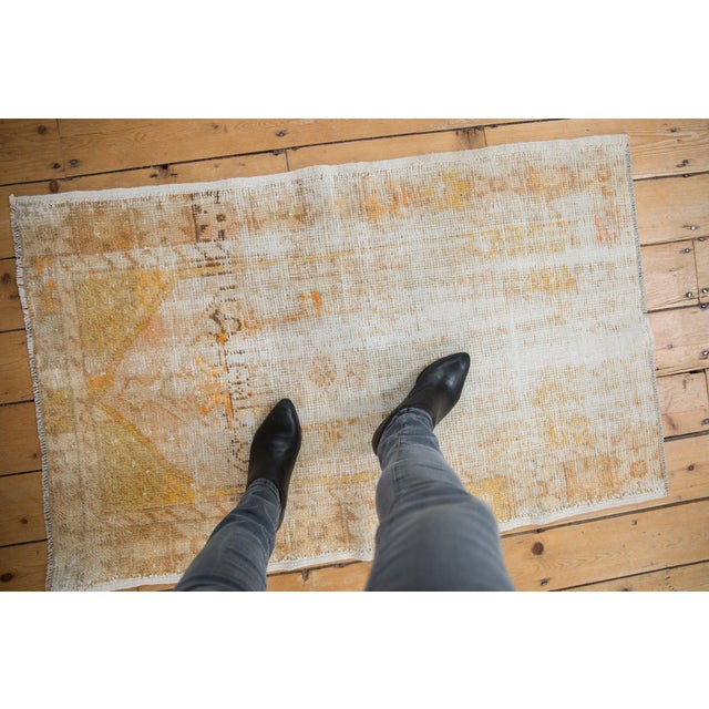 :: Oversized center medallion with large scale floral bouquet outlines adorned at either end by diminutive finials....