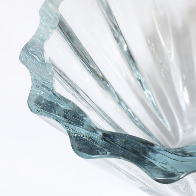 This luminous Mid-Century Modernist Strombergshyttan Blue Crystal Fluted Glass Bowl originated in Sweden, circa 1960. The...