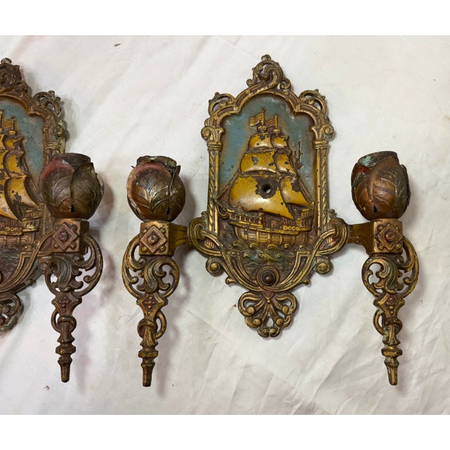Up for sale is an exquisite pair of antique Spanish Galleon electric wall sconces from the 1920s. These sconces are...