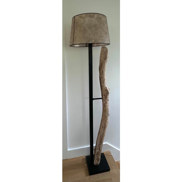 This unique floor lamp features a rustic driftwood piece sourced from Kennebunkport ME, naturally textured and curved,...