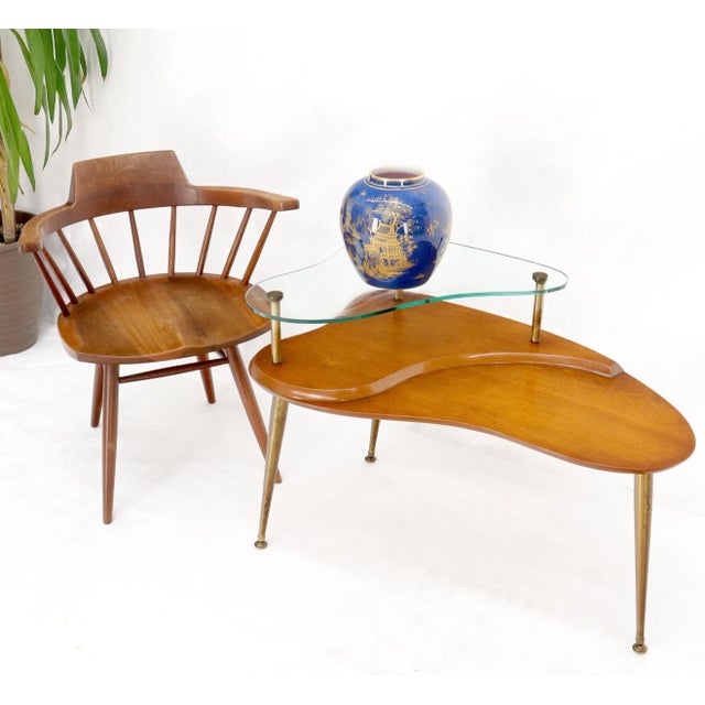 Mid-Century Modern organic shape two tier glass top brass cone shape tapered T-tri legged coffee table.