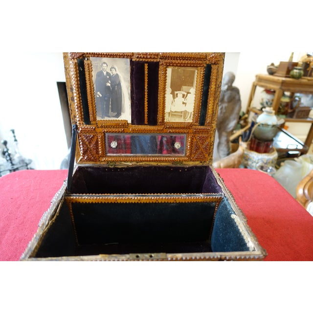 Superb example of a particularly well-crafted Tramp Art box. Probably a wedding box with portraits of the bride and groom...