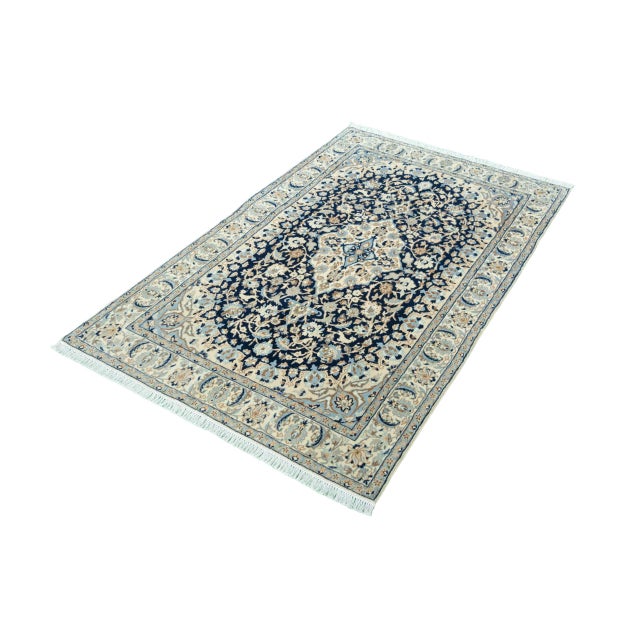 This magnificent Nain 9La oriental rug is exquisitely handcrafted and impresses with its high-quality craftsmanship and...