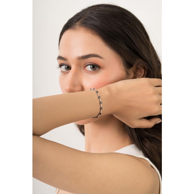This tennis bracelet is featuring 3.39 carat pear-shaped blue sapphires set in 14K white gold. Each sapphire measuring...