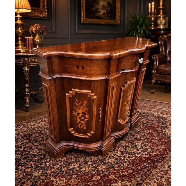 A beautifully crafted antique walnut serpentine sideboard, dating to circa 1900 and distinguished by its elegant shaped...