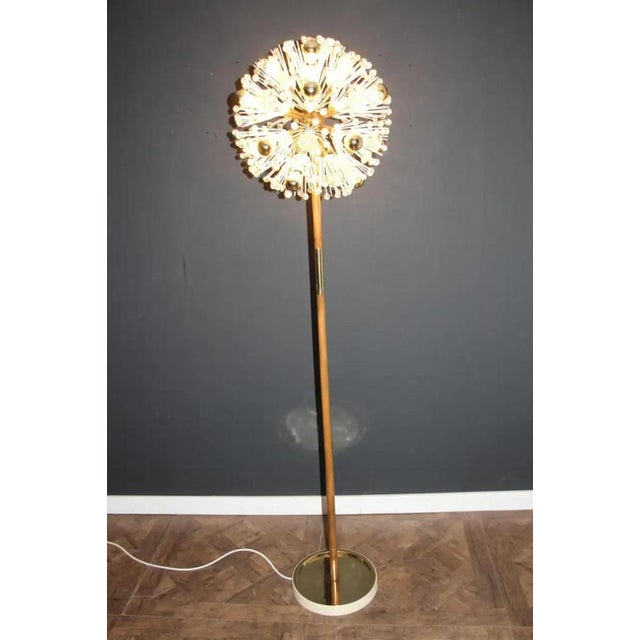 This spectacular Sputnik floor lamp looks like a flowers explosion.It features a multitude of brass rods ending with bulbs...