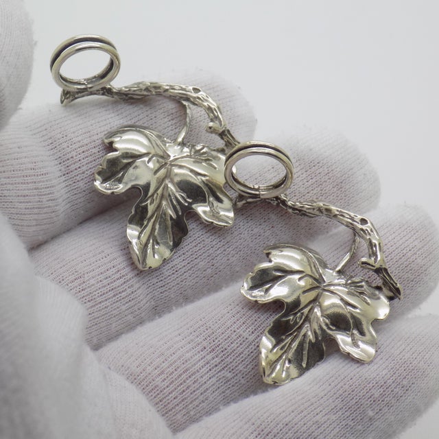 Elegant pair of vintage leaf shaped table place holders, handmade in Italy between the 1970s and 1980s in genuine Italian...