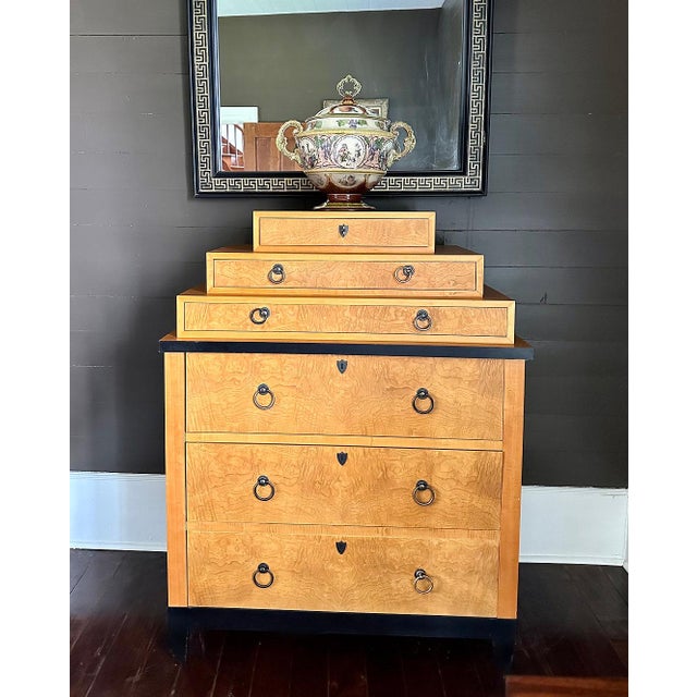 This stunning, rare, Biedermeier style burl wood and primavera highboy dresser was made by Baker Furniture USA, circa...