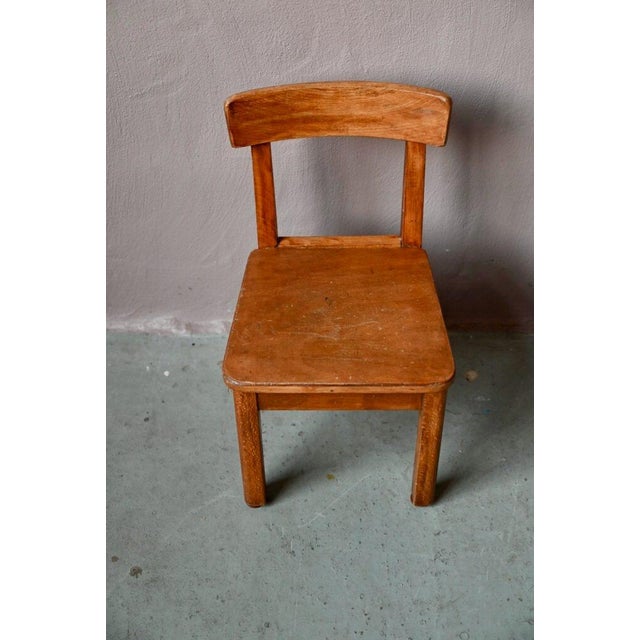 Vintage children's chairs often possess a certain tenderness and charm. Made entirely of wood, this one pairs easily with...