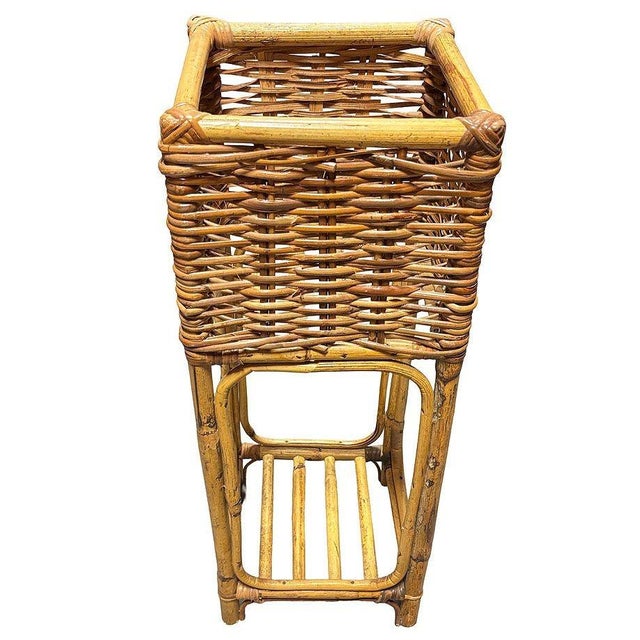 This beautifully restored cubed woven rattan plant stand is a charming blend of natural textures and timeless Paul T...