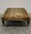 George Smith Standard Style Ottoman on turned legs with brasses casters in a textured knit leopard print fabric. There is...