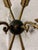 These are a pair of vintage French Empire Revival brass and enamel wall sconces, featuring a distinctive arrow motif and...