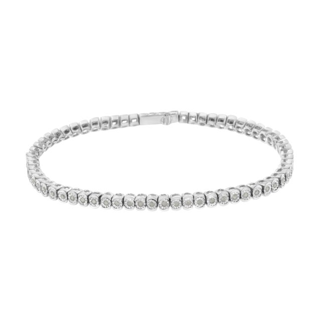 Elegant and timeless, this gorgeous sterling silver link bracelet features 0.5 carat total weight of round diamonds with a...