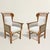 These mid-20th-century French wing chairs have all the ingredients of traditional country furniture, but someone clearly...