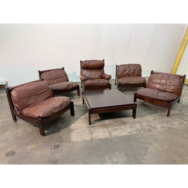 This rare and cohesive leather lounge set from the 1960s is attributed to Carl Straub and exemplifies the relaxed...