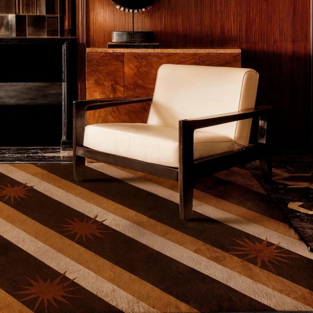 The Star Dust rug captivates with diagonal stripes in brown, cream, and nude, dotted with fun star-like details. A neutral...