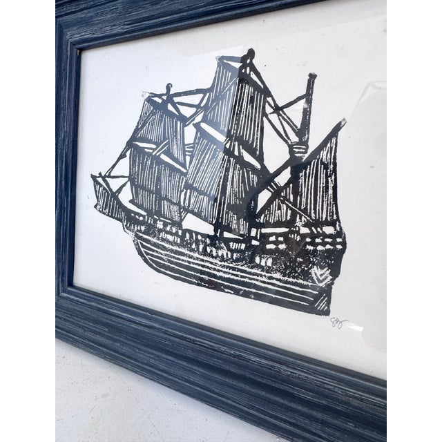 This is a vintage black and white black print of an old ship. It is signed on the lower right corner. In a wood frame,...