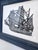 This is a vintage black and white black print of an old ship. It is signed on the lower right corner. In a wood frame,...