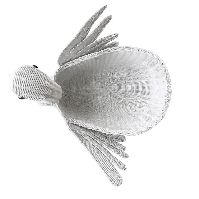 Whimsical yet undeniably chic, this monumental white wicker swan basket is the kind of statement piece that instantly...