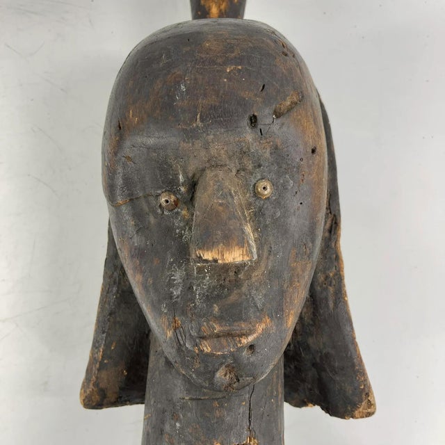 This exquisitely sculpted head was traditionally associated with figures and masks prevalent across a vast region spanning...