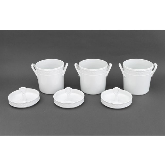 Set of Three KPM Berlin "Kurland" Pattern Blanc de Chine Porcelain Ice Buckets, each cover and pail with blue underglaze...