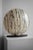 This ambient lamp has a round lampshade with a hand-painted abstract pattern. The lampshade is made of plastic and is...