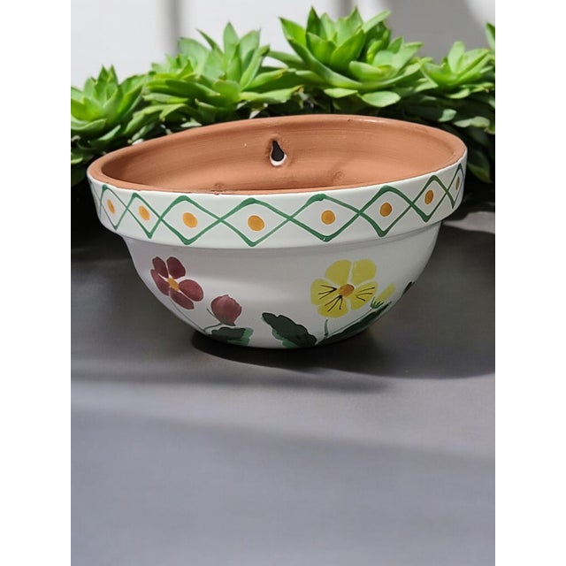 Add a touch of Tuscan charm to your home décor with this exquisite Handmade Italian Terra Cotta Wall Planter. Crafted in...