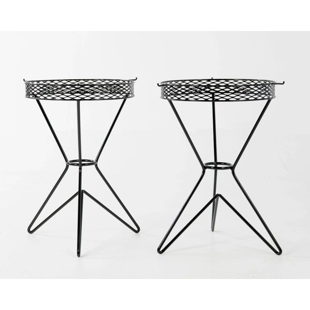 A pair of atomic age side tables after Tony Paul and Fredrick Weinberg. Three hairpin legs support a mesh frame. No glass,...