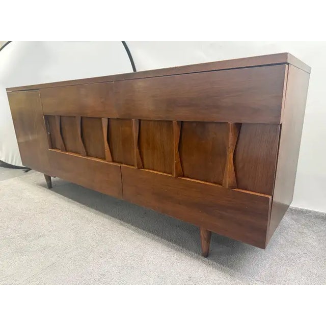 Mid-Century Modern American of Martinsville Walnut 9-Drawer Dresser or Credenza Crafted in richly grained walnut, the...