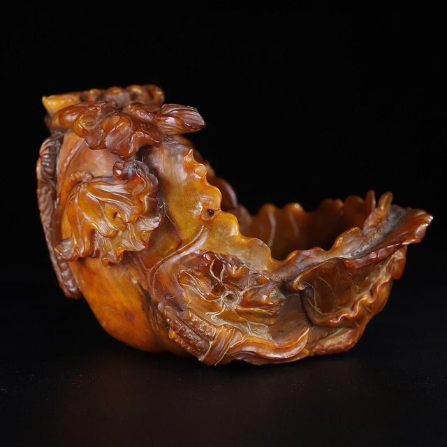 A striking Chinese carved horn brush washer (bitong), traditionally used by scholars for calligraphy and painting. The...