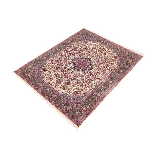 Designed with mesmerizing intricacy and gorgeous color palette, this hand-knotted masterpiece demonstrates the beauty and...