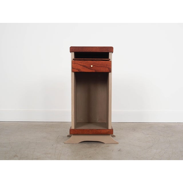 The cabinet was made in the 1960s in Denmark. The structure is covered with oak veneer. The cabinet is placed on a wooden...