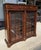 This Pennsylvania House Courtland Manor Two-Door Bookcase features a rich traditional wood finish, fluted column details,...