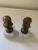 Vintage old brass child busts on white marble basis. They can be used as a bookends or a paperweight.