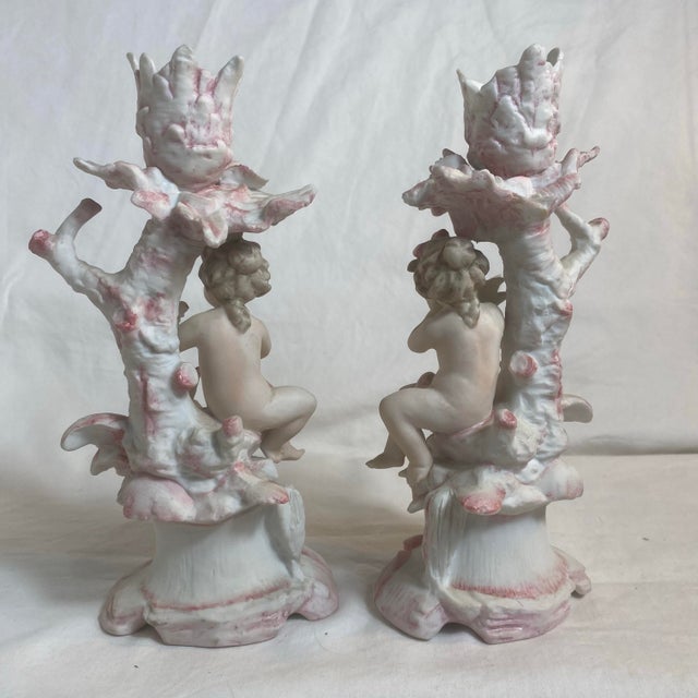 Delightful pair of cherub candlesticks. Arnart company contracted out work to Japan which in turn was imported back.No...