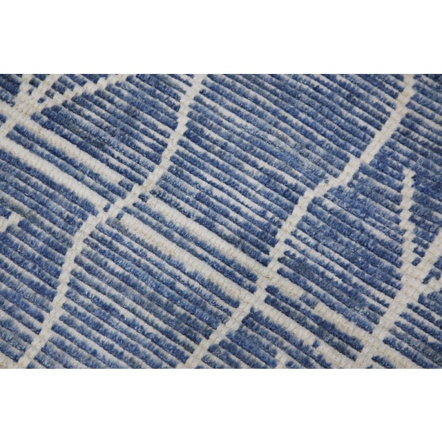 Introducing our exquisite handwoven wool modern Moroccan-style rug, a stunning blend of traditional craftsmanship and...