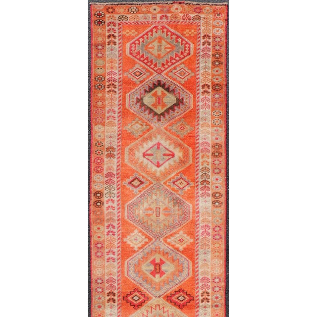Measures: 2'9 x 13'3 Turkish vintage oushak runner with Tribal Medallion Design in orange and ivory. Keivan Woven Arts /...