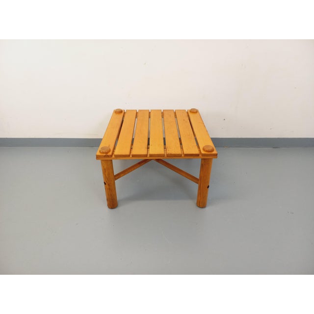 Vintage square coffee table from the 1970s/80s, made of solid pine, in the style of Rainer Daumiller, with a slatted...