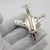 Combining historical military prestige with clever mechanical design, this vintage silver miniature model depicts the...