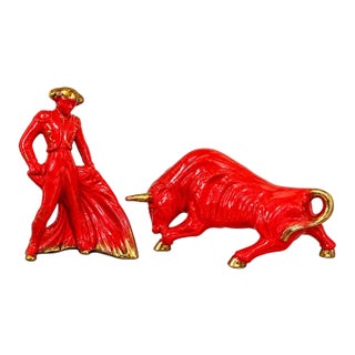 Large Pair of 1950s MCM Glossy Firehouse Red and Gilded Kt Gold Paint Accents Ceramic Fighting Bull and Matador Figurines For Sale