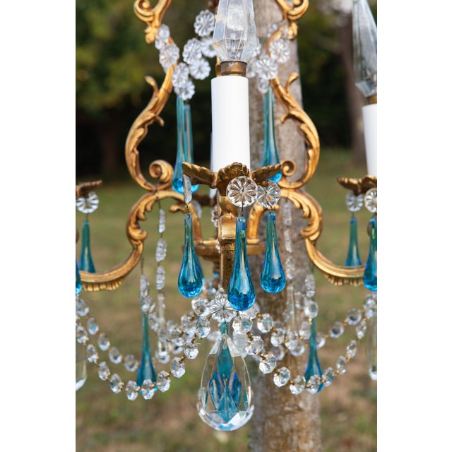It works with 4 E14 type bulbs. High quality blue crystals. European Plug (up to 250V).The wiring of this item may be...
