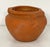 A pair of fine large English round garden urns or planter pots of terracotta, approximately 17 1/2 inches in diameter,...